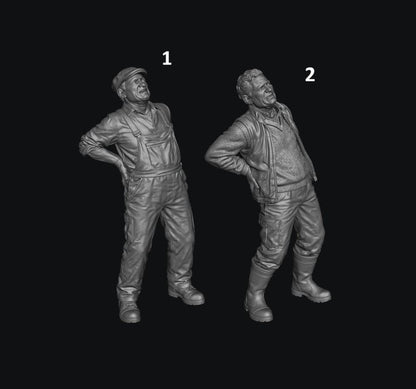 Two unpainted grey 3D-printed resin scale figures of elderly farmers in workwear suffering from back pain.
