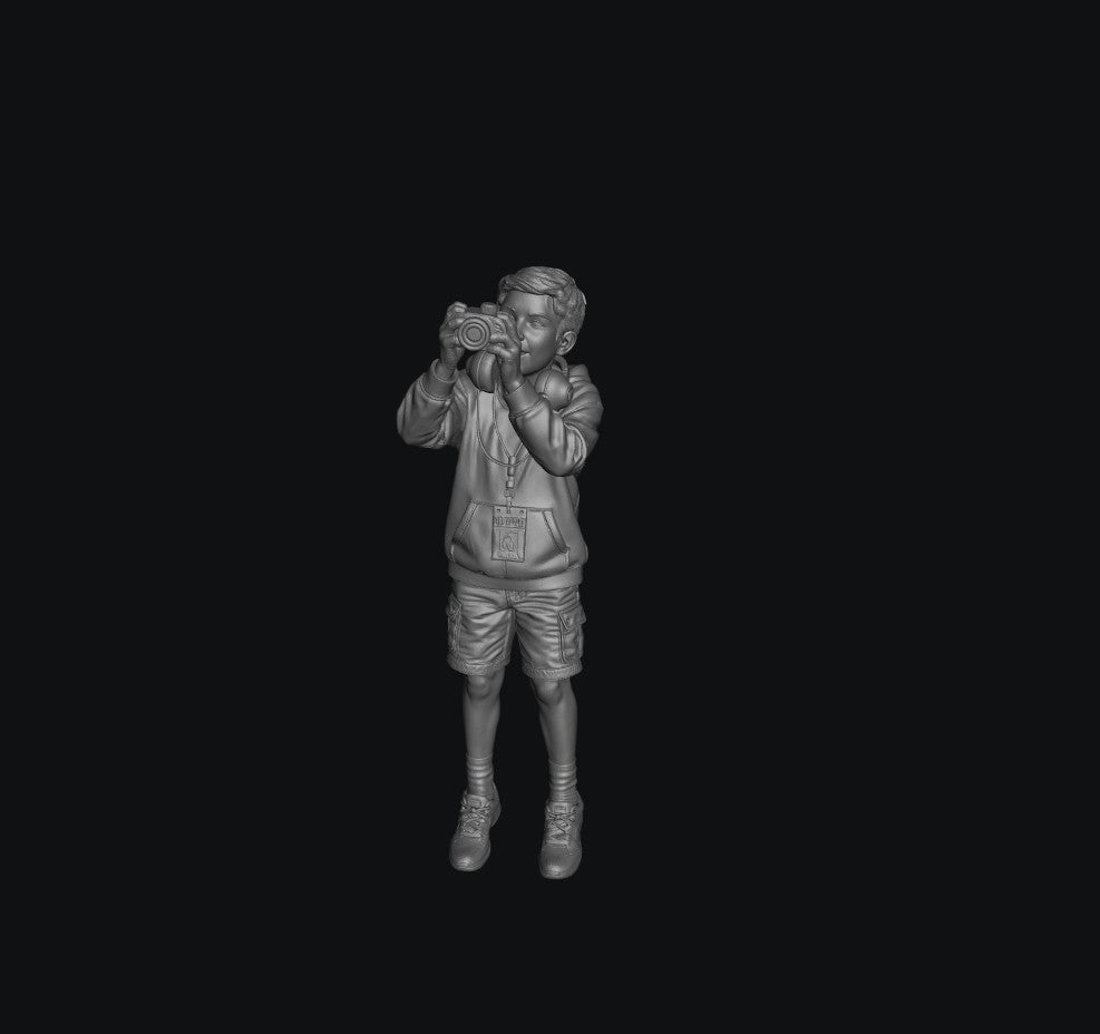 WOSC011 - Young Boy with a Camera