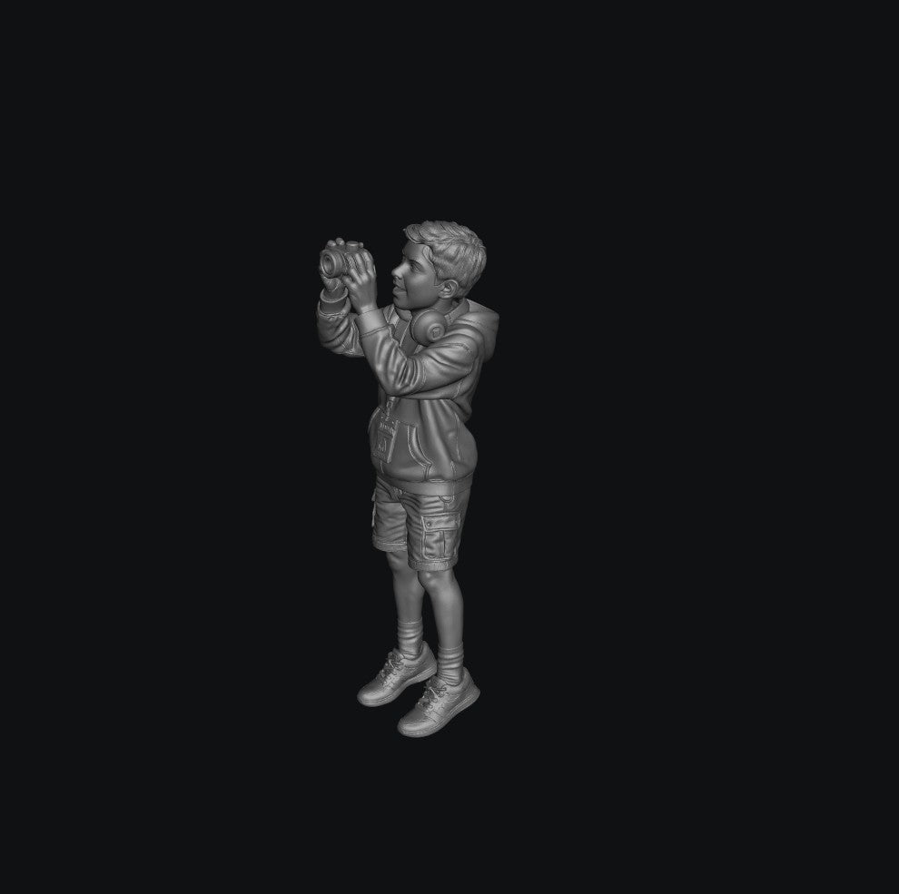 WOSC011 - Young Boy with a Camera