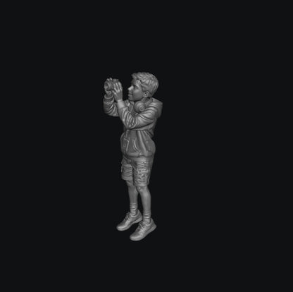 WOSC011 - Young Boy with a Camera